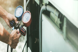 Schneider Mechanical technician recharging AC.